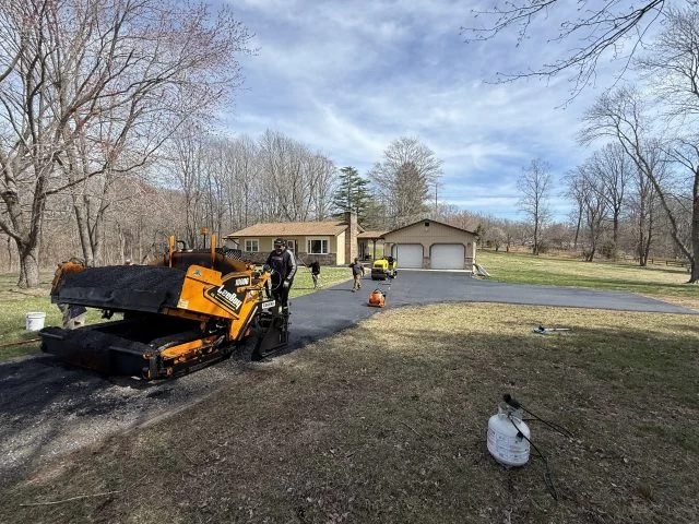 South State Paving paver working a long rural driveway South State Paving paver working a long rural driveway